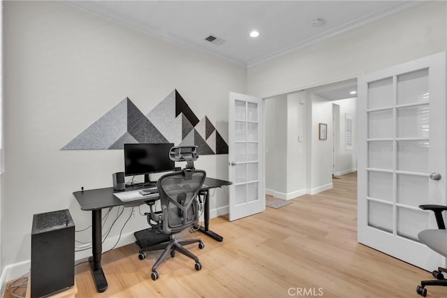 home office featuring crown molding, french doors, baseboards, visible vents, and wood finished floors