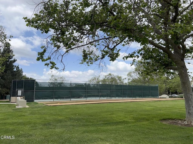 12084 London Grove Ct, Moorpark, CA 93021 - surrounding community featuring a lawn, a tennis court, and fence