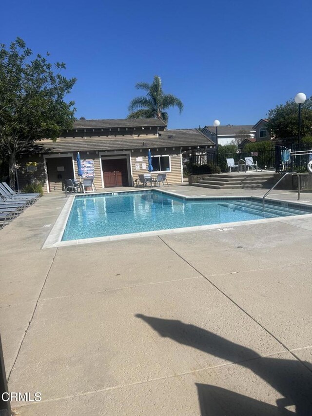 12084 London Grove Ct, Moorpark, CA 93021 - pool featuring a patio and fence