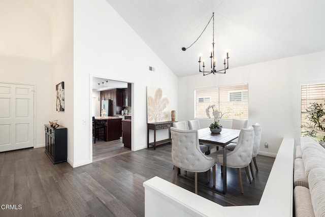 12084 London Grove Ct, Moorpark, CA 93021 - dining space featuring a chandelier, high vaulted ceiling, dark wood-style floors, healthy amount of natural light, and baseboards