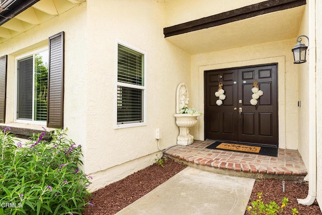 12084 London Grove Ct, Moorpark, CA 93021 - view of exterior entry featuring stucco siding