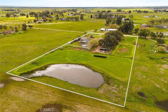 drone / aerial view with a water view and a rural view