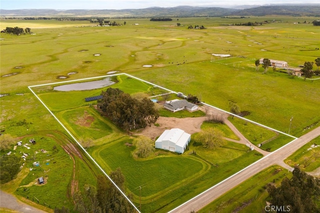 birds eye view of property featuring a rural view