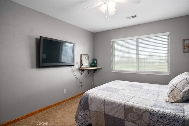 bedroom featuring carpet floors, baseboards, ceiling fan, and visible vents