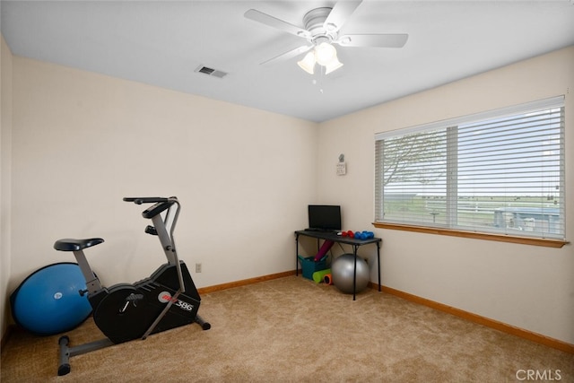 exercise room featuring a ceiling fan, carpet, baseboards, and visible vents