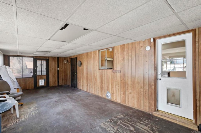 13954 Hazel Dr, Lytle Creek, CA 92358 - unfurnished room featuring a wealth of natural light, wooden walls, concrete floors, and a drop ceiling