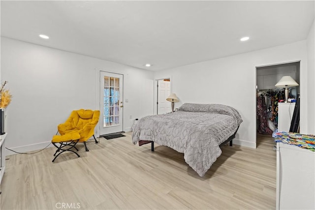 730 E 89th St, Los Angeles, CA 90002 - bedroom featuring light wood finished floors, recessed lighting, a walk in closet, and baseboards