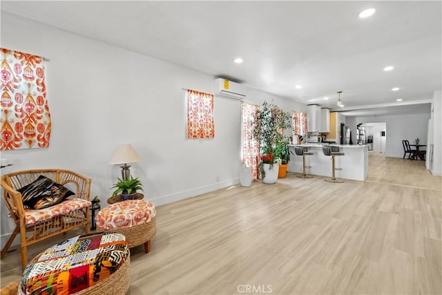730 E 89th St, Los Angeles, CA 90002 - living room with recessed lighting, light wood-style floors, baseboards, and a wall mounted AC