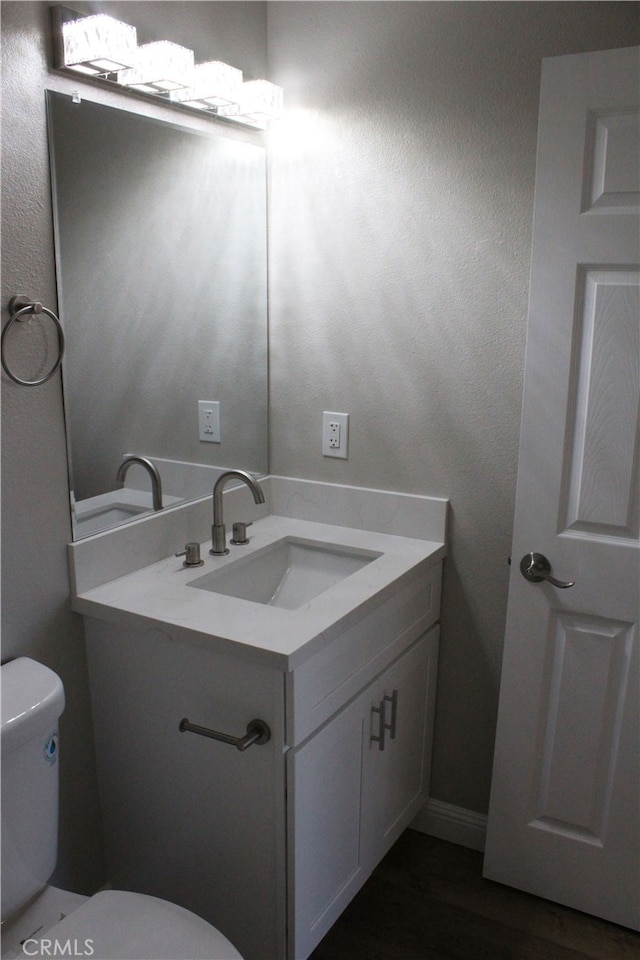 17730 Ivy Ave, Fontana, CA 92335 - half bath with toilet, wood finished floors, and vanity