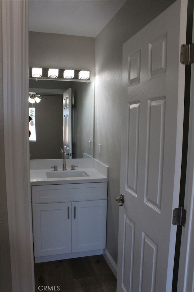 17730 Ivy Ave, Fontana, CA 92335 - bathroom with ceiling fan, wood finished floors, and vanity