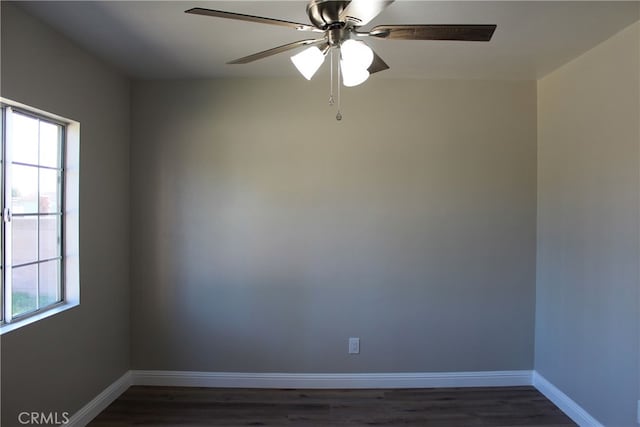 17730 Ivy Ave, Fontana, CA 92335 - unfurnished room with dark wood finished floors, plenty of natural light, a ceiling fan, and baseboards