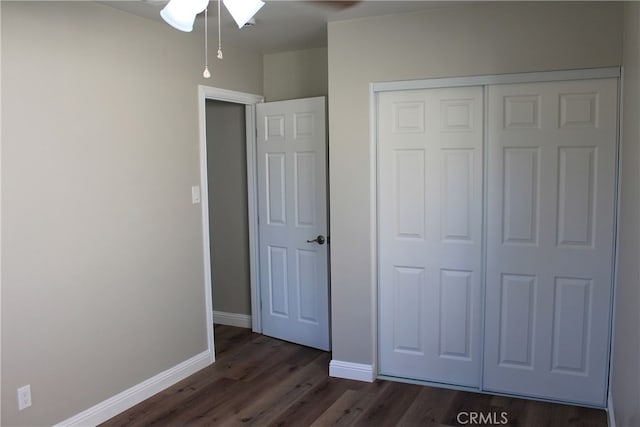 17730 Ivy Ave, Fontana, CA 92335 - unfurnished bedroom with a closet, dark wood-type flooring, and baseboards