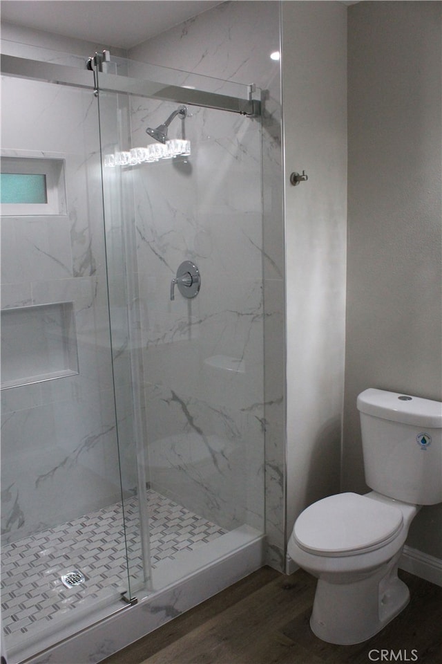 17730 Ivy Ave, Fontana, CA 92335 - full bath with a marble finish shower, toilet, and wood finished floors