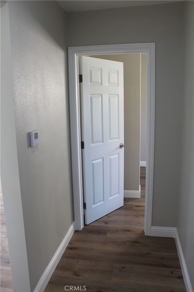 17730 Ivy Ave, Fontana, CA 92335 - hallway featuring dark wood-style floors and baseboards