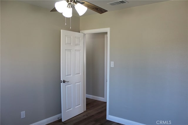 17730 Ivy Ave, Fontana, CA 92335 - spare room with dark wood finished floors, a ceiling fan, visible vents, and baseboards