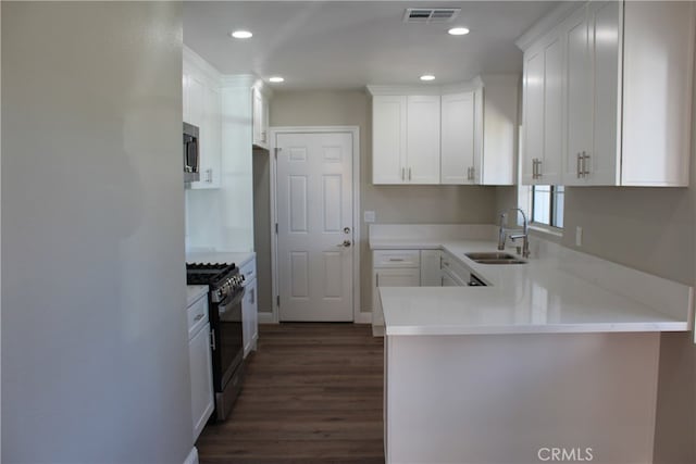 17730 Ivy Ave, Fontana, CA 92335 - kitchen featuring visible vents, freestanding refrigerator, a sink, range with gas cooktop, and stainless steel microwave