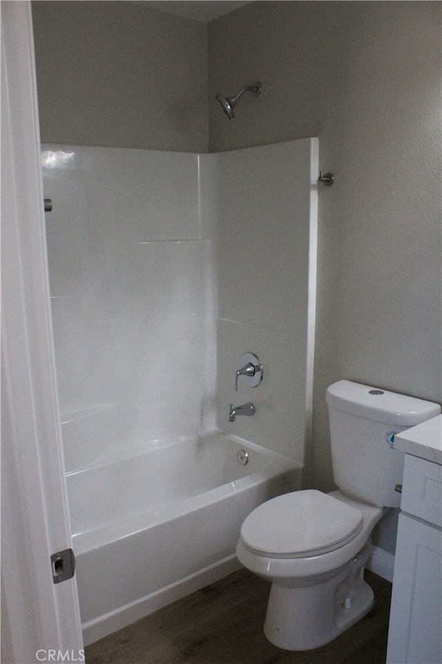 17730 Ivy Ave, Fontana, CA 92335 - bathroom with toilet, vanity, bathing tub / shower combination, and wood finished floors