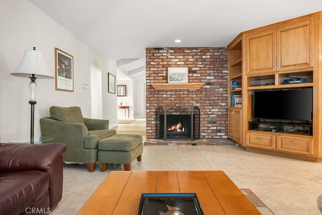 living room featuring a brick fireplace, light tile patterned floors, and vaulted ceiling
