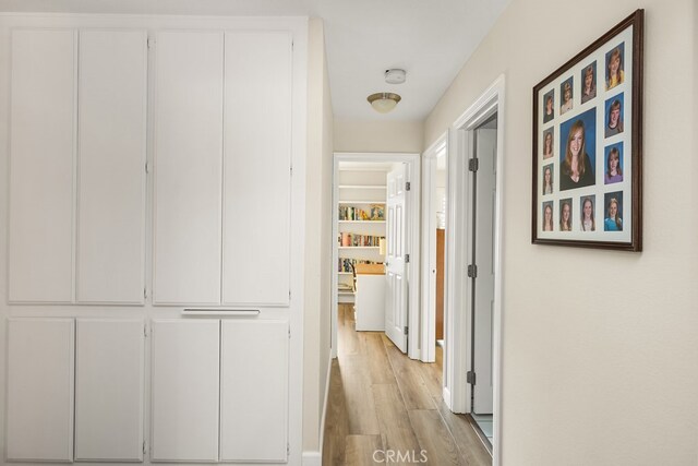 corridor with light wood-style flooring