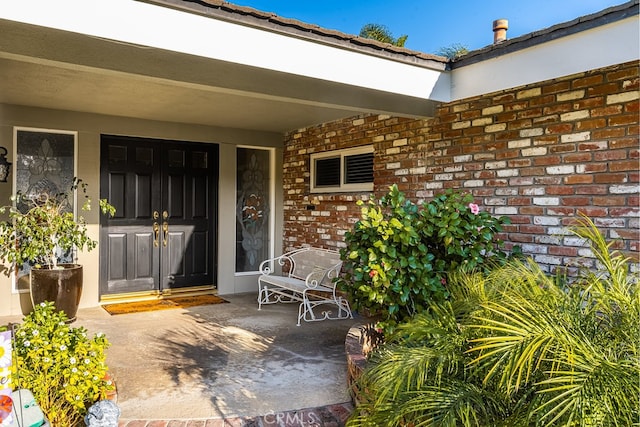 entrance to property with brick siding