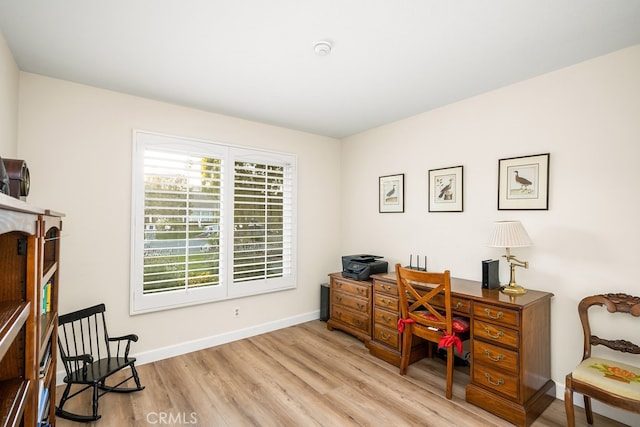 home office featuring light wood-style floors and baseboards