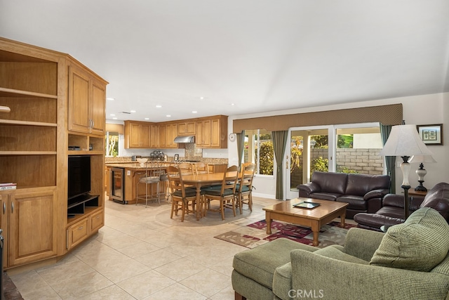 living area with wine cooler, light tile patterned floors, and recessed lighting