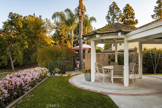 view of yard with a gazebo, fence, and a patio area
