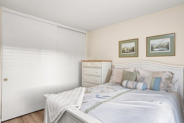 bedroom with light wood finished floors