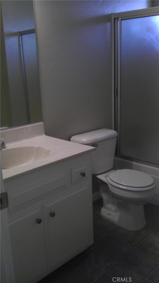 414 Nobel Ave Unit D, Santa Ana, CA 92707 - bathroom with tile patterned floors, toilet, vanity, and a textured wall