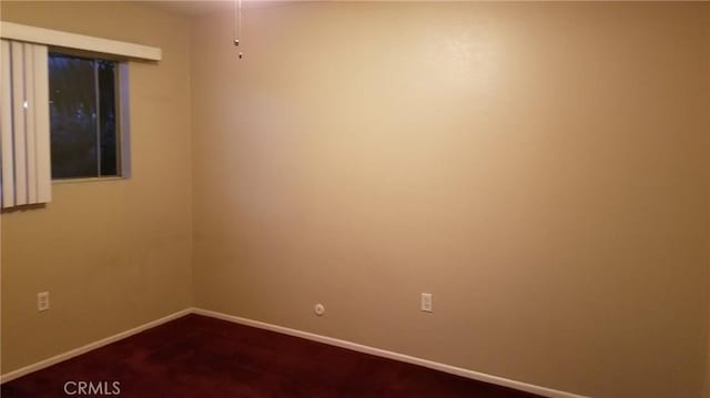 414 Nobel Ave Unit D, Santa Ana, CA 92707 - empty room featuring baseboards and dark colored carpet