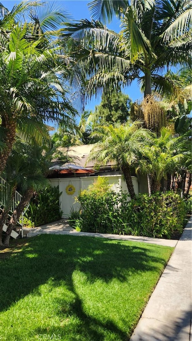 414 Nobel Ave Unit D, Santa Ana, CA 92707 - view of property exterior featuring a lawn and stucco siding