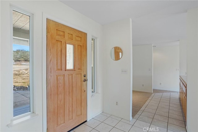 foyer featuring light tile patterned floors