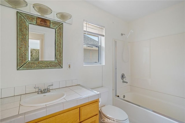 full bath with toilet, vanity, and shower / washtub combination