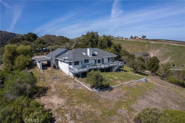 birds eye view of property with a rural view