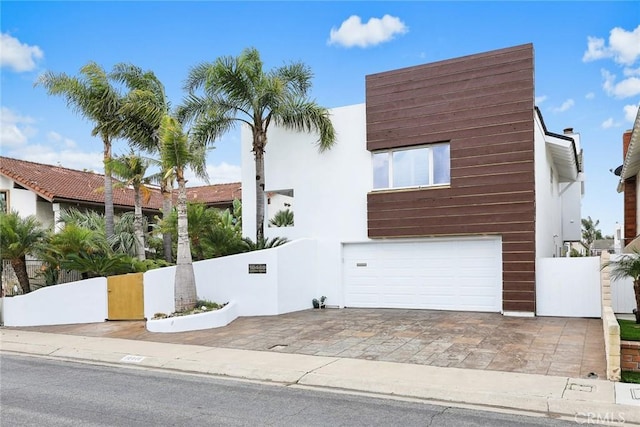 16449 Ladona Cir, Huntington Beach, CA 92649 - view of front of house with an attached garage and stucco siding