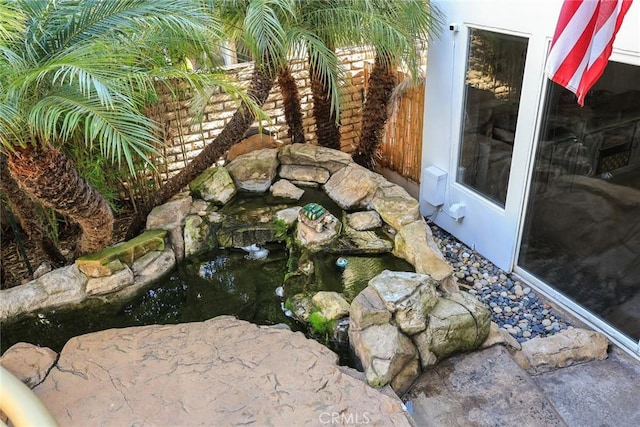 16449 Ladona Cir, Huntington Beach, CA 92649 - exterior view of a garden pond