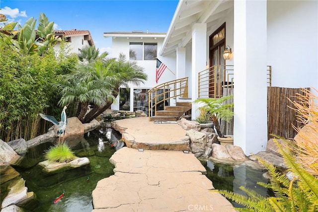 16449 Ladona Cir, Huntington Beach, CA 92649 - view of patio / terrace featuring a garden pond