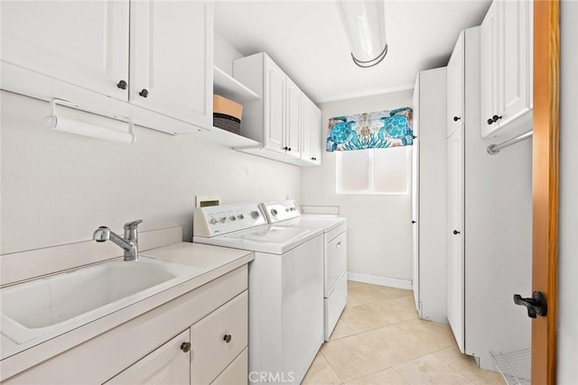 16449 Ladona Cir, Huntington Beach, CA 92649 - washroom featuring washer and dryer, cabinet space, and light tile patterned floors