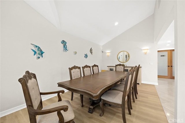 16449 Ladona Cir, Huntington Beach, CA 92649 - dining space featuring high vaulted ceiling, baseboards, light wood-style flooring, and recessed lighting