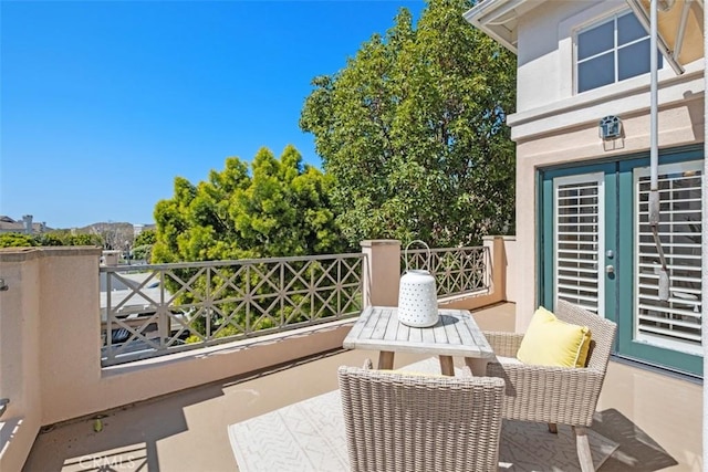 view of patio featuring a balcony