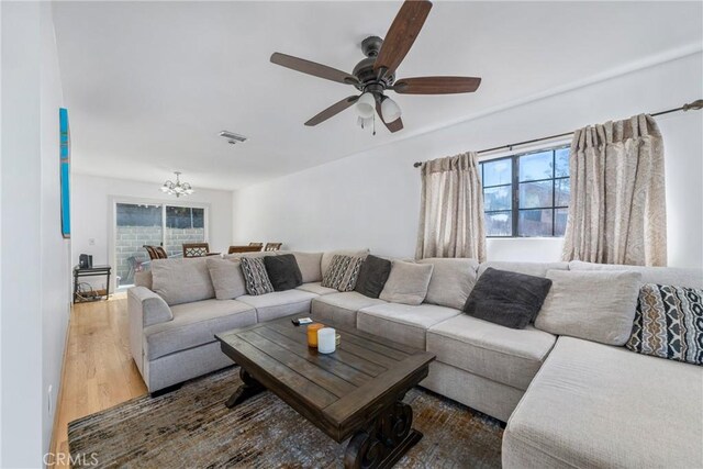 1116 Herbert Ave, Los Angeles, CA 90063 - living area with a chandelier, wood finished floors, and ceiling fan