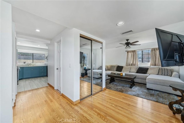 1116 Herbert Ave, Los Angeles, CA 90063 - living room featuring light wood finished floors, a ceiling fan, healthy amount of natural light, recessed lighting, and baseboards