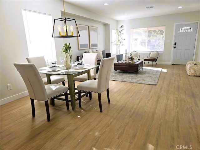 dining area featuring recessed lighting, baseboards, visible vents, and light wood finished floors