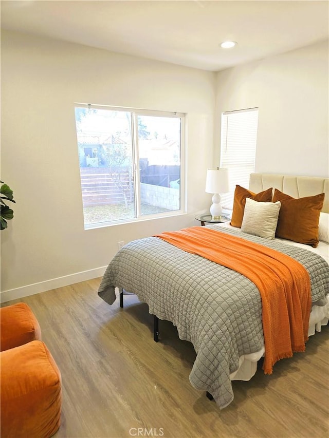 bedroom featuring recessed lighting, baseboards, and wood finished floors