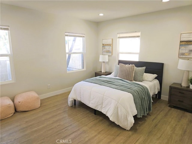 bedroom featuring recessed lighting, baseboards, and wood finished floors