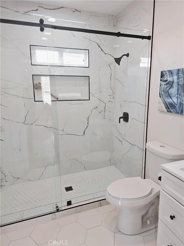 full bathroom with vanity, toilet, and a marble finish shower