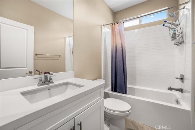 bathroom with tile patterned flooring, shower / bath combo with shower curtain, toilet, and vanity