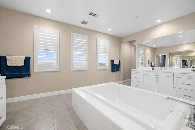 bathroom with a bath, visible vents, recessed lighting, and vanity