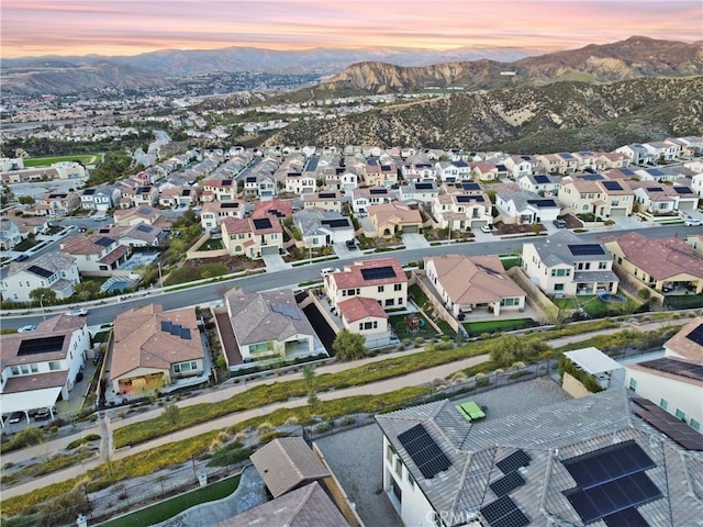 aerial view at dusk with a residential view and a mountain view