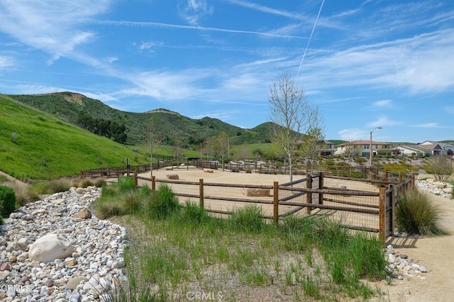exterior space with an enclosed area and a mountain view